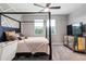 Modern bedroom with dark wood furniture, natural light, and decorative accents at 750 116Th Ne Ct, Bradenton, FL 34212