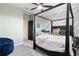 Modern bedroom featuring dark wood furniture, ample natural light, and a stylish design at 750 116Th Ne Ct, Bradenton, FL 34212