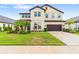 Charming two-story home with landscaped yard and attached two car garage at 750 116Th Ne Ct, Bradenton, FL 34212