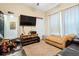 Personal cave featuring TV, entertainment center, and leather chaise lounge at 750 116Th Ne Ct, Bradenton, FL 34212