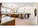Second floor living room with wet bar and comfortable leather furnishings at 750 116Th Ne Ct, Bradenton, FL 34212