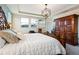 Stylish main bedroom with luxury linens, a decorative headboard, and ample natural light at 750 116Th Ne Ct, Bradenton, FL 34212