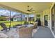 Inviting screened-in patio with cozy seating area, grill, and scenic backyard views at 750 116Th Ne Ct, Bradenton, FL 34212