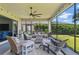 Charming screened-in patio with comfortable seating, ceiling fan, and relaxing outdoor space at 750 116Th Ne Ct, Bradenton, FL 34212