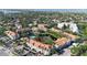 Aerial view of condo complex with pond, pool and lush landscaping in a desirable community at 850 S Tamiami Trl # 207, Sarasota, FL 34236