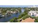Breathtaking aerial view of the waterfront community, highlighting its serene waterway and beautiful coastal scenery at 850 S Tamiami Trl # 207, Sarasota, FL 34236