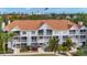 Multi-Gathering building with beautiful landscaping, open balconies, and stairs, plus city views and palm trees at 850 S Tamiami Trl # 207, Sarasota, FL 34236
