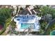 Community pool, hot tub, clubhouse and landscaping at 850 S Tamiami Trl # 207, Sarasota, FL 34236