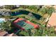 Tennis court and pond located in the community at 850 S Tamiami Trl # 207, Sarasota, FL 34236
