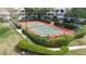 Overhead shot of community tennis court with lush green landscaping at 850 S Tamiami Trl # 207, Sarasota, FL 34236