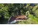 Aerial view of a private wooden deck and pathway, offering a secluded spot to enjoy the outdoors at 850 S Tamiami Trl # 207, Sarasota, FL 34236