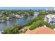 Waterfront property with canal access, lush greenery, and city skyline views at 850 S Tamiami Trl # 730, Sarasota, FL 34236