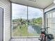 Relax on this screened in balcony with views of the pond and tennis court at 850 S Tamiami Trl # 730, Sarasota, FL 34236