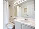 Clean and bright bathroom with shower-tub combo, white vanity, and a well-lit mirror at 850 S Tamiami Trl # 730, Sarasota, FL 34236