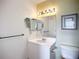 This well-lit bathroom features a mirrored cabinet, ample counter space, and stylish fixtures at 850 S Tamiami Trl # 730, Sarasota, FL 34236