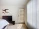 Bright bedroom with access to balcony offering abundant natural light and ample space to watch TV at 850 S Tamiami Trl # 730, Sarasota, FL 34236