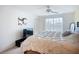 Sunlit bedroom offering ample space to watch TV and access to a large window overlooking neighborhood views at 850 S Tamiami Trl # 730, Sarasota, FL 34236
