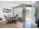 Dining area with a round glass table and sliding glass doors at 850 S Tamiami Trl # 730, Sarasota, FL 34236
