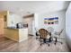Bright dining area with modern lighting, laminate floors, and a view of the kitchen at 850 S Tamiami Trl # 730, Sarasota, FL 34236
