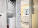Conveniently located in-unit stackable washer and dryer, with laundry closet near bathroom entrance at 850 S Tamiami Trl # 730, Sarasota, FL 34236