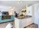 Open-concept living area with a kitchen island, comfortable seating, and a view of the staircase at 850 S Tamiami Trl # 730, Sarasota, FL 34236