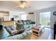 Open floor plan living room with bright light and modern furnishings at 850 S Tamiami Trl # 730, Sarasota, FL 34236