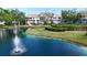 Community pond with a fountain, surrounded by lush landscaping and well-maintained grounds at 850 S Tamiami Trl # 730, Sarasota, FL 34236