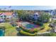 Condominium complex with a tennis court and beautifully maintained green space at 850 S Tamiami Trl # 730, Sarasota, FL 34236