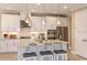Modern kitchen with stainless steel appliances, gray cabinets, granite countertops, and pendant lighting at 8550 Big Dipper Dr, Sarasota, FL 34241
