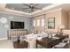 Upstairs living room featuring stylish decor, comfortable seating, and a large flat screen TV at 8550 Big Dipper Dr, Sarasota, FL 34241