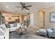 Open-concept living area with kitchen, stairs, and a view of the backyard at 8550 Big Dipper Dr, Sarasota, FL 34241