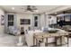 Bright living room featuring elegant decor, herringbone floors and seamless indoor/outdoor living at 8550 Big Dipper Dr, Sarasota, FL 34241