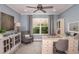 Bright home office featuring custom desk, comfortable chair, and a stylish decorative cabinet at 8550 Big Dipper Dr, Sarasota, FL 34241