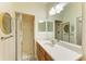 Bright bathroom with a glass shower, vanity, and ample counter space at 9121 Stone Harbour Loop, Bradenton, FL 34212