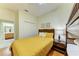 Cozy bedroom showcasing a closet, a nightstand, and wooden floors at 9121 Stone Harbour Loop, Bradenton, FL 34212