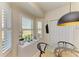 Breakfast nook with bay window, white shutters, and modern pendant light at 9121 Stone Harbour Loop, Bradenton, FL 34212