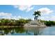 A welcoming entrance sign for Heritage Harbour reflected in the water at 9121 Stone Harbour Loop, Bradenton, FL 34212