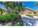 Well-maintained single-Gathering homes with neatly manicured lawns and tropical landscaping at 9121 Stone Harbour Loop, Bradenton, FL 34212