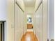 Hallway view leading to a bathroom with a vanity and mirror at 9121 Stone Harbour Loop, Bradenton, FL 34212