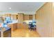 Bright, open kitchen with ample cabinet space, modern appliances, and a built-in home office area at 9121 Stone Harbour Loop, Bradenton, FL 34212