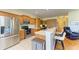 Well-equipped kitchenette featuring stainless steel appliances, custom cabinetry, and an adjacent office space at 9121 Stone Harbour Loop, Bradenton, FL 34212