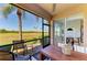 Screened-in lanai with views of the surrounding golf course and tropical vegetation at 9121 Stone Harbour Loop, Bradenton, FL 34212