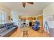 Bright and airy living space with an open kitchen, breakfast bar, hardwood floors, and comfortable furniture at 9121 Stone Harbour Loop, Bradenton, FL 34212