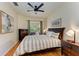 Comfortable main bedroom with a ceiling fan, wood floors, and natural light at 9121 Stone Harbour Loop, Bradenton, FL 34212