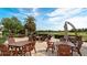 Outdoor patio with comfortable seating around tables and golf course views at 9121 Stone Harbour Loop, Bradenton, FL 34212