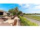 Outdoor patio area with a fire pit and seating, overlooking a golf course at 9121 Stone Harbour Loop, Bradenton, FL 34212