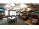 Spacious restaurant with tables and chairs, a bar area, and ample natural light from large windows at 9121 Stone Harbour Loop, Bradenton, FL 34212