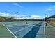 View of several tennis courts with lighting on a sunny day within the community at 9121 Stone Harbour Loop, Bradenton, FL 34212