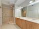 Bathroom with a spacious double vanity and walk-in shower at 9429 Discovery Ter # 102B, Bradenton, FL 34212