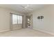 Bright bedroom with neutral carpeting, window, and glass sliding door at 9429 Discovery Ter # 102B, Bradenton, FL 34212